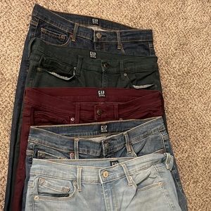 Gap true skinny size 29 tall dark wash with gold stitching.